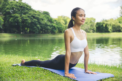 Full length of young woman in lake