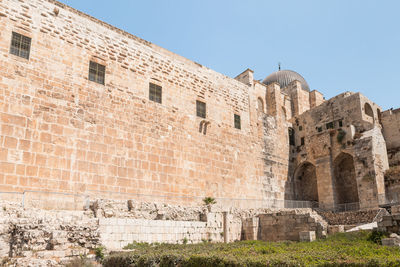 Low angle view of historical building against clear sky