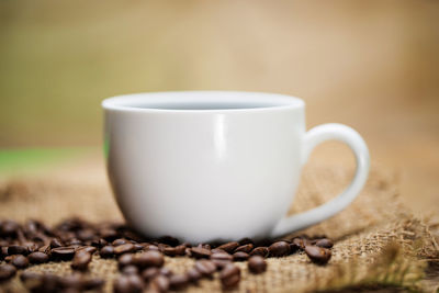 Close-up of coffee cup on table