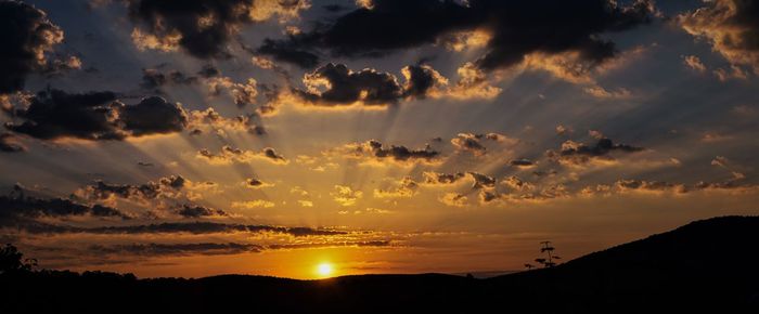 Scenic view of dramatic sky during sunset