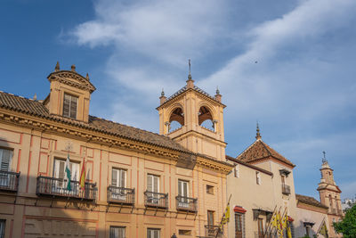 Low angle view of historic building against cloudy sky