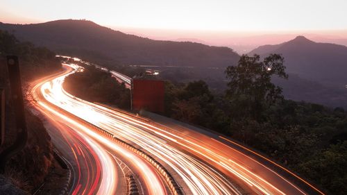 High angle view of light trails on road in city