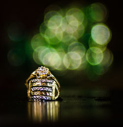 Close-up of wedding rings on table