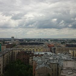 Buildings against cloudy sky