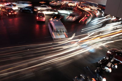 Light trails on road in city at night