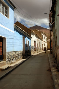 Empty alley amidst buildings in town