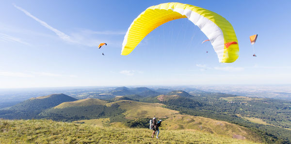 Paragliding at the top of the puy de dome in front of the puys chain in auvergne