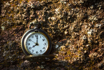 Close-up of clock on wall