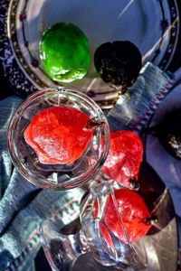 High angle view of red wine in glass on table