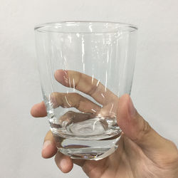 Close-up of person holding glass