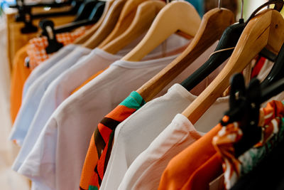 Close-up of clothes hanging on rack