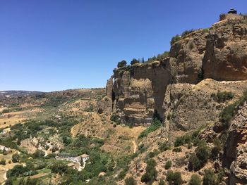 View of castle on mountain against clear sky