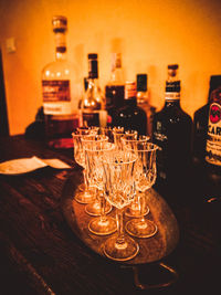 Close-up of wine glass bottles on table