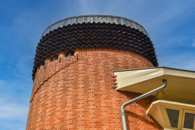 Facades of  brick construction of residential building in amsterdam school style architecture