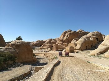 Rock formations against clear blue sky