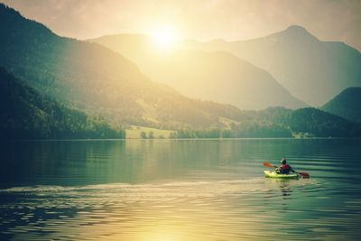 Scenic view of lake against sky during sunset