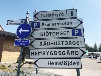 Road sign against sky