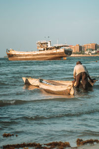 Boat in sea against clear sky