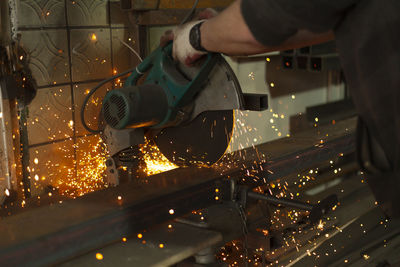 Sawing steel. circular saw and sparks. production details. metal cutting. details of work.