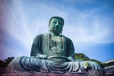 Low angle view of statue of big buddha in kamakura, japan