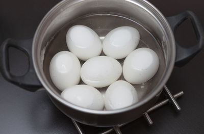 High angle view of eggs in container on table