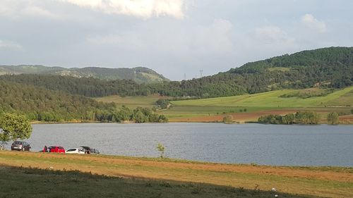 Scenic view of agricultural field against sky