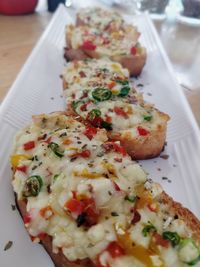 Close-up of pizza served on table