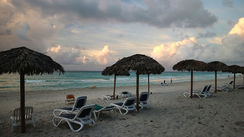 Scenic view of beach against sky during sunset