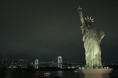 Low angle view of statue at night