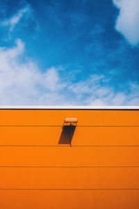 Low angle view of buildings against blue sky