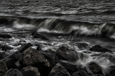 Scenic view of rocks at sea shore
