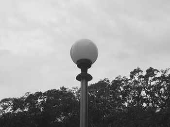 Low angle view of street light against sky