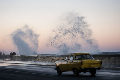 Car on road against clear sky