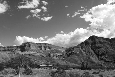 Scenic view of mountains against cloudy sky