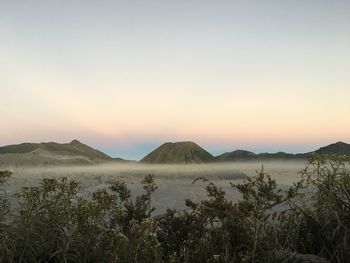 Scenic view of landscape against sky during sunset