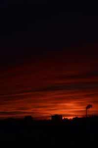 Scenic view of silhouette trees against sky at sunset