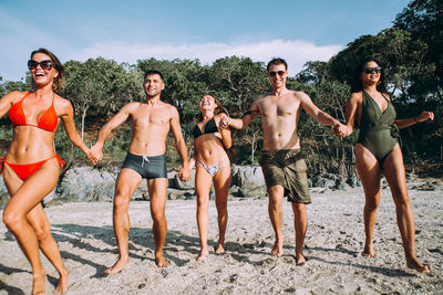 Young couple standing on friends