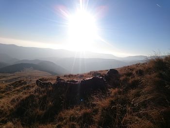 Sun shining over mountains