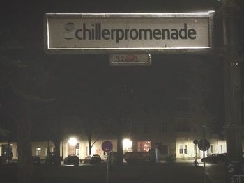 Illuminated information sign at night