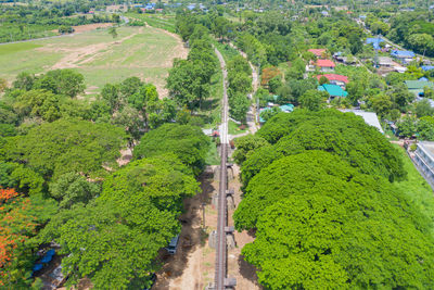 High angle view of road amidst trees in city