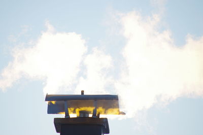 Low angle view of illuminated lamp against sky