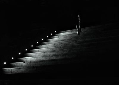 Illuminated street light in city