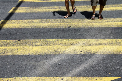 Low section of people crossing road