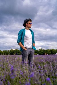 Full length of man standing on field against sky