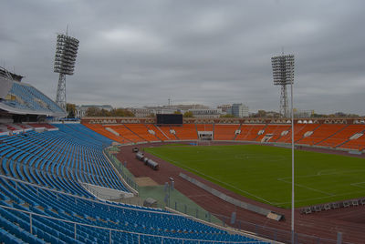 High angle view of soccer field against cloudy sky