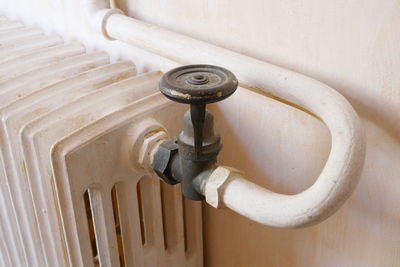 Close-up of radiator by wall