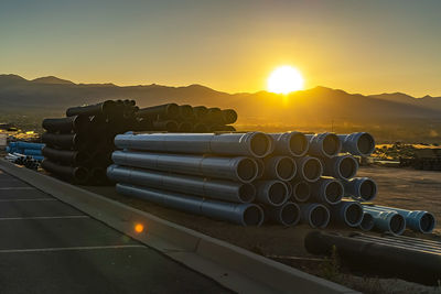 Metallic structure against sky during sunset