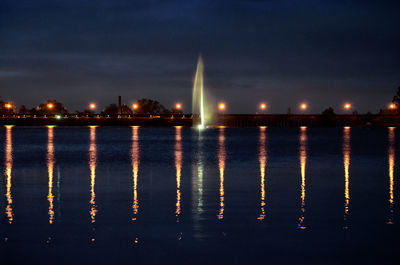 View of illuminated buildings at waterfront