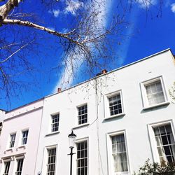Low angle view of building against blue sky