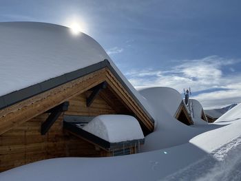 Snow covered building against sky